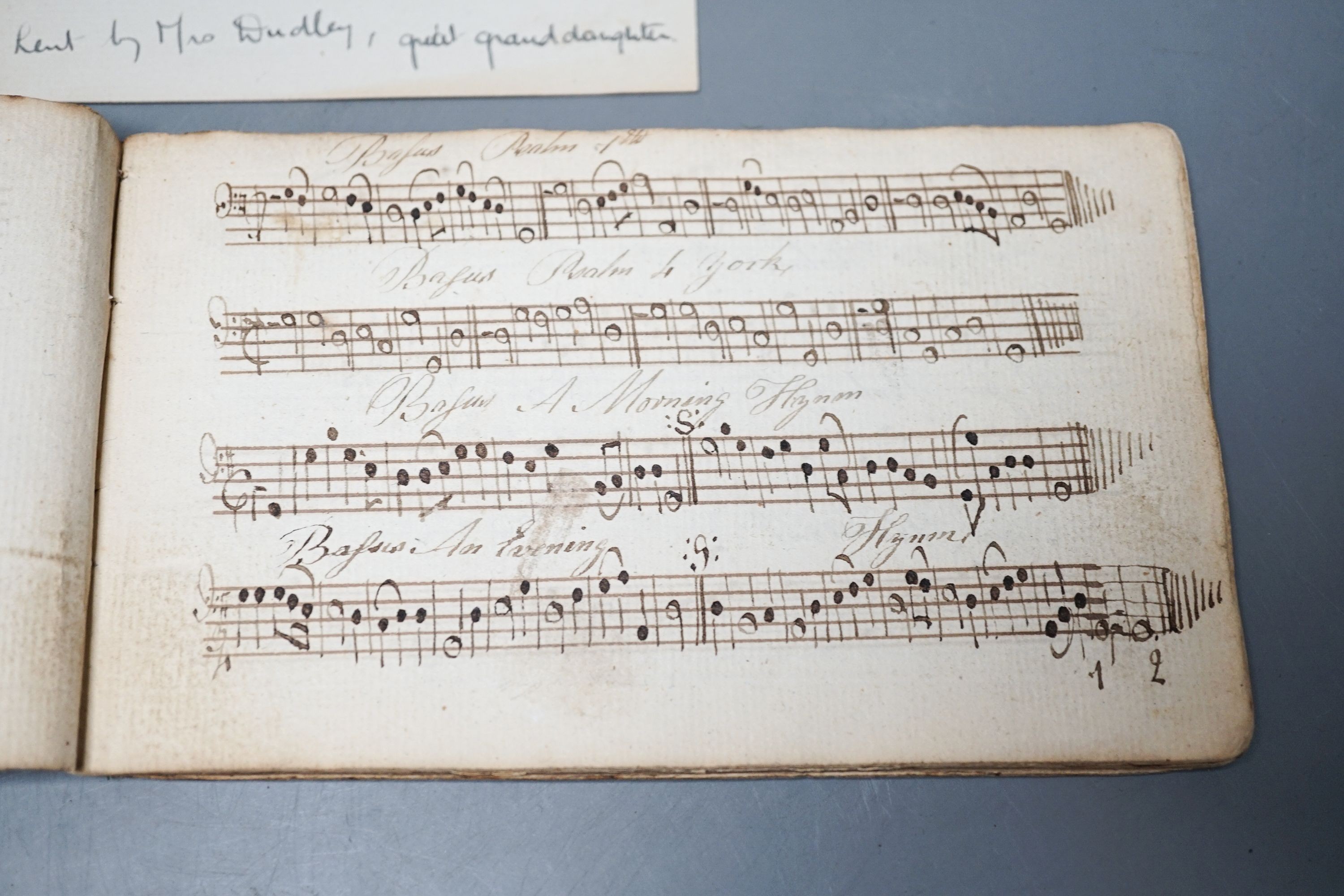 An 18th century book of hand-written psalm notations, inscribed ‘John Cooper his singing book 1794’